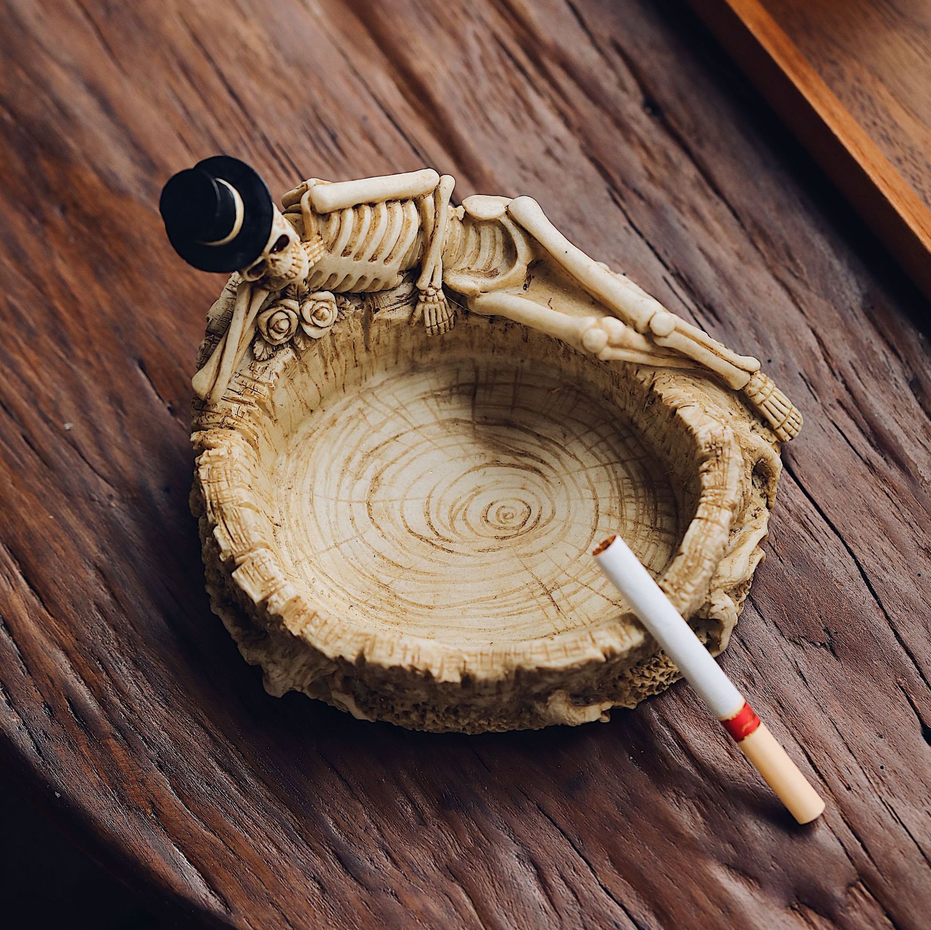 Cool Horizontal Skeleton Ashtray On Table