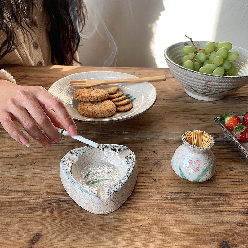 Japanese Triangular Ceramic Ashtray On Table