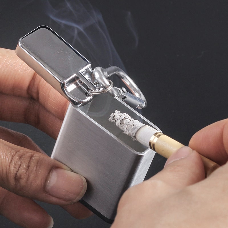stub out cigarette using porable ashtray