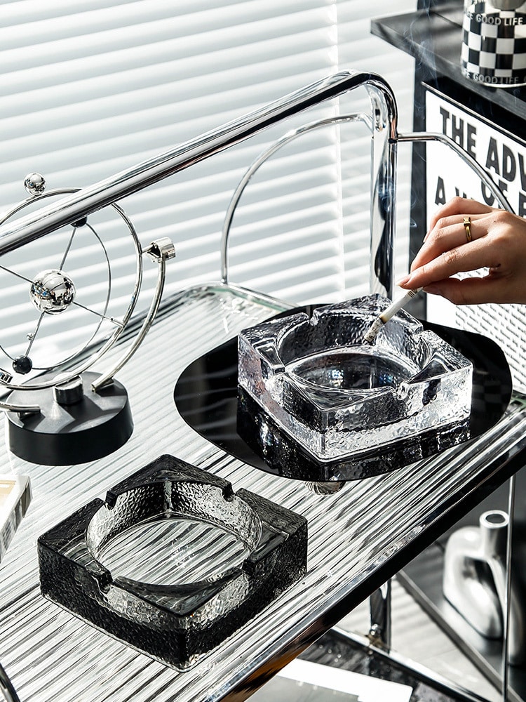 Stylish Glass Ashtrays On Table